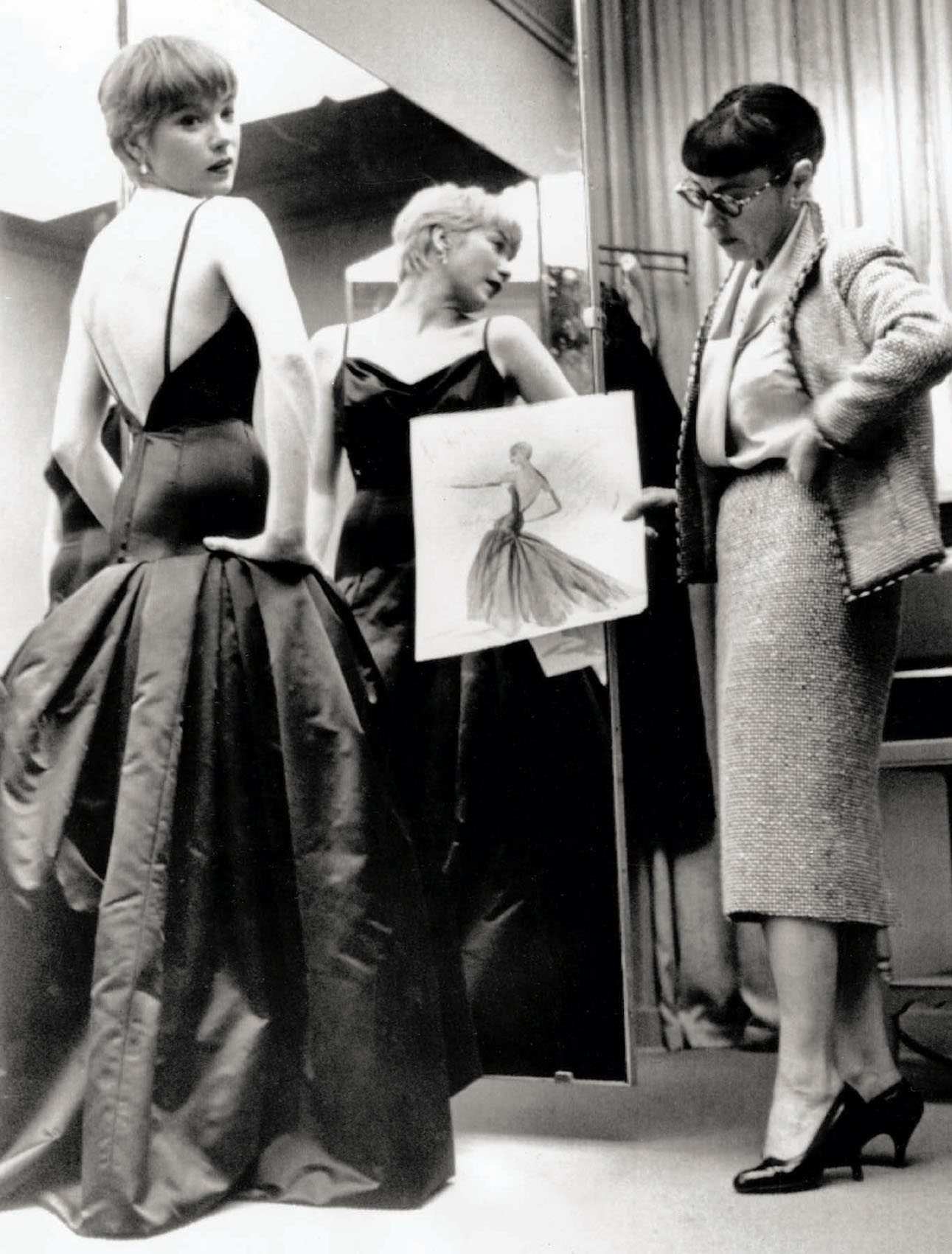 Shirley MacLaine and Edith Head during a fitting for Career (1959).