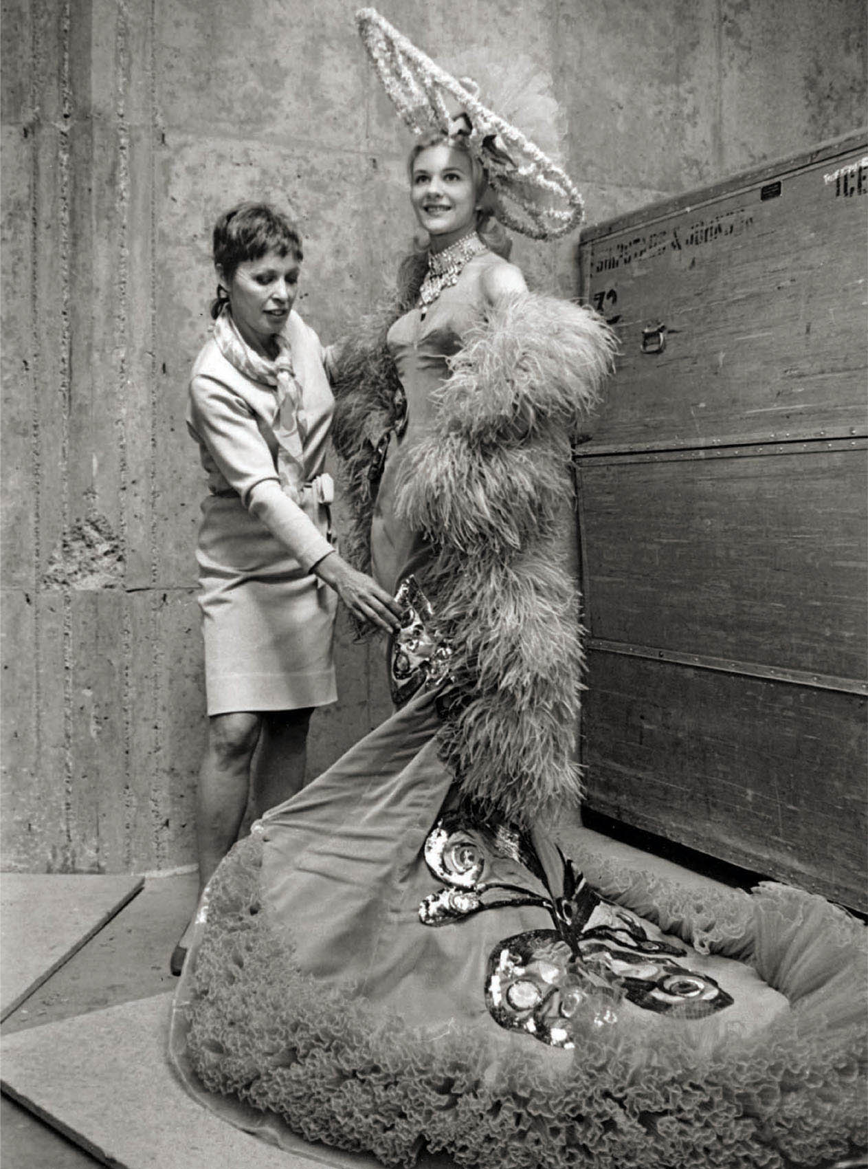 Costume designer Helen Colvig (left) fits skater Carol Cooper for ice Follies (1968).