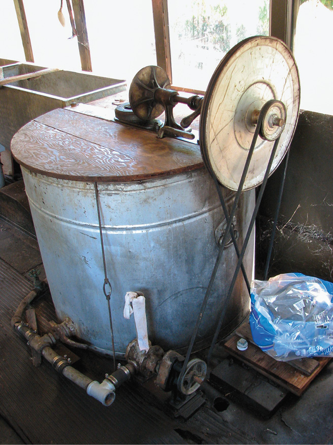 image of a barrel with a spinning wheel attached