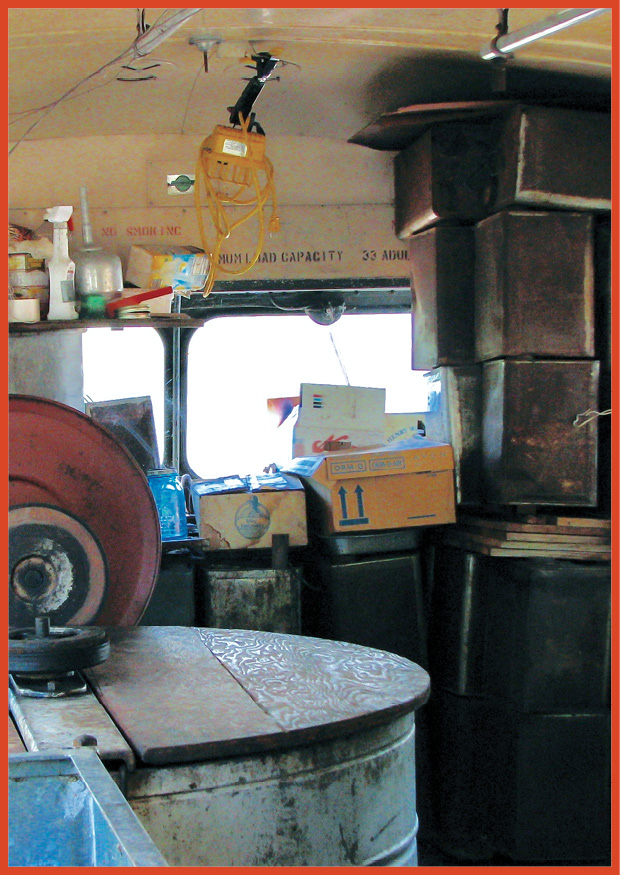 interior of a bus showing boxes and barrels