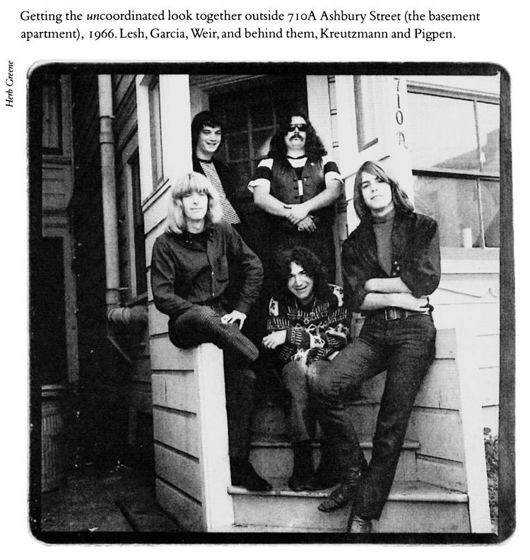 Getting the uncoordinated look together outside 710A Ashbury Street (the basement apartment), 1966. Lesh, Garcia, Weir, and behind them, Kreutzmann and Pigpen.