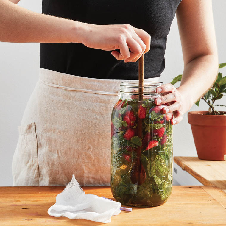 Stirring the jar of ingredients.