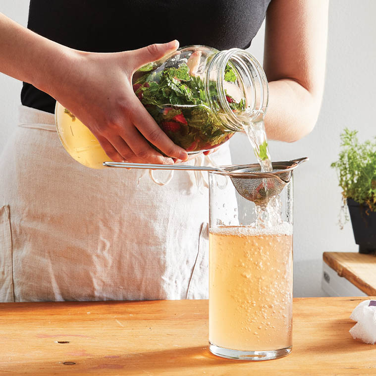 Straining the solid ingredients.