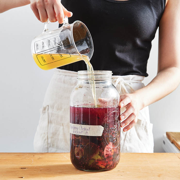 Adding water to the jar.