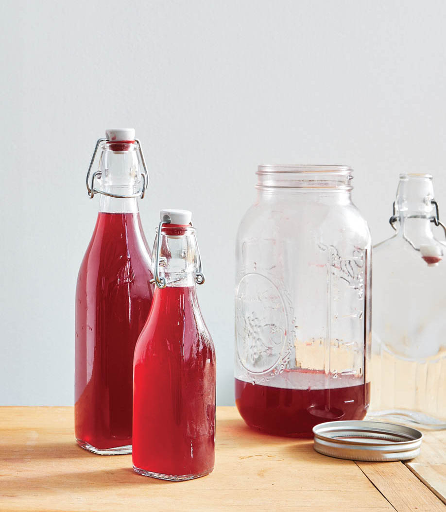 Jars and bottles of blackberry cordial.