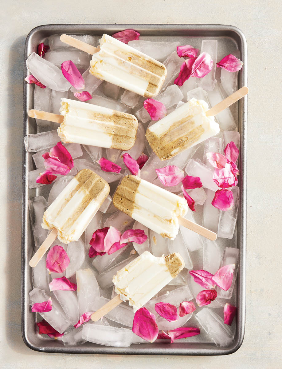 A tray of matcha rose yogurt pops on ice.