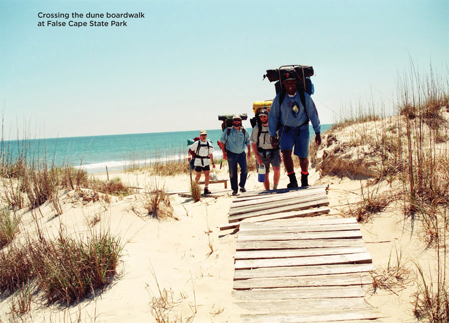 Crossing the dune boardwalk at False Cape State Park