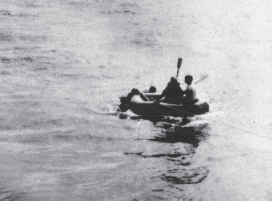 After sinking a U-boat, most DE skippers would attempt to rescue the German sailors, who then were taken on board, fed and clothed, and had their injuries attended to by the pharmacist’s mates. Here sailors from the USS Chatelain leave the ship in a raft to rescue survivors after the U-515 was sunk on Easter Sunday 1944. As Captain Werner Henke, the U-boat skipper, was picked up, he tried to capsize the raft twice. After boatswain’s mate Victor Coleman, with a raised oar, threatened the captain, Henke settled down. Photo taken by Joseph Villanella; courtesy the photographer