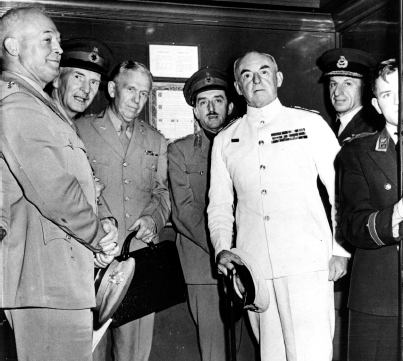 Admiral Pound, in white, crowded into an elevator with his CCS colleagues, Quebec, August 1943. Corbis