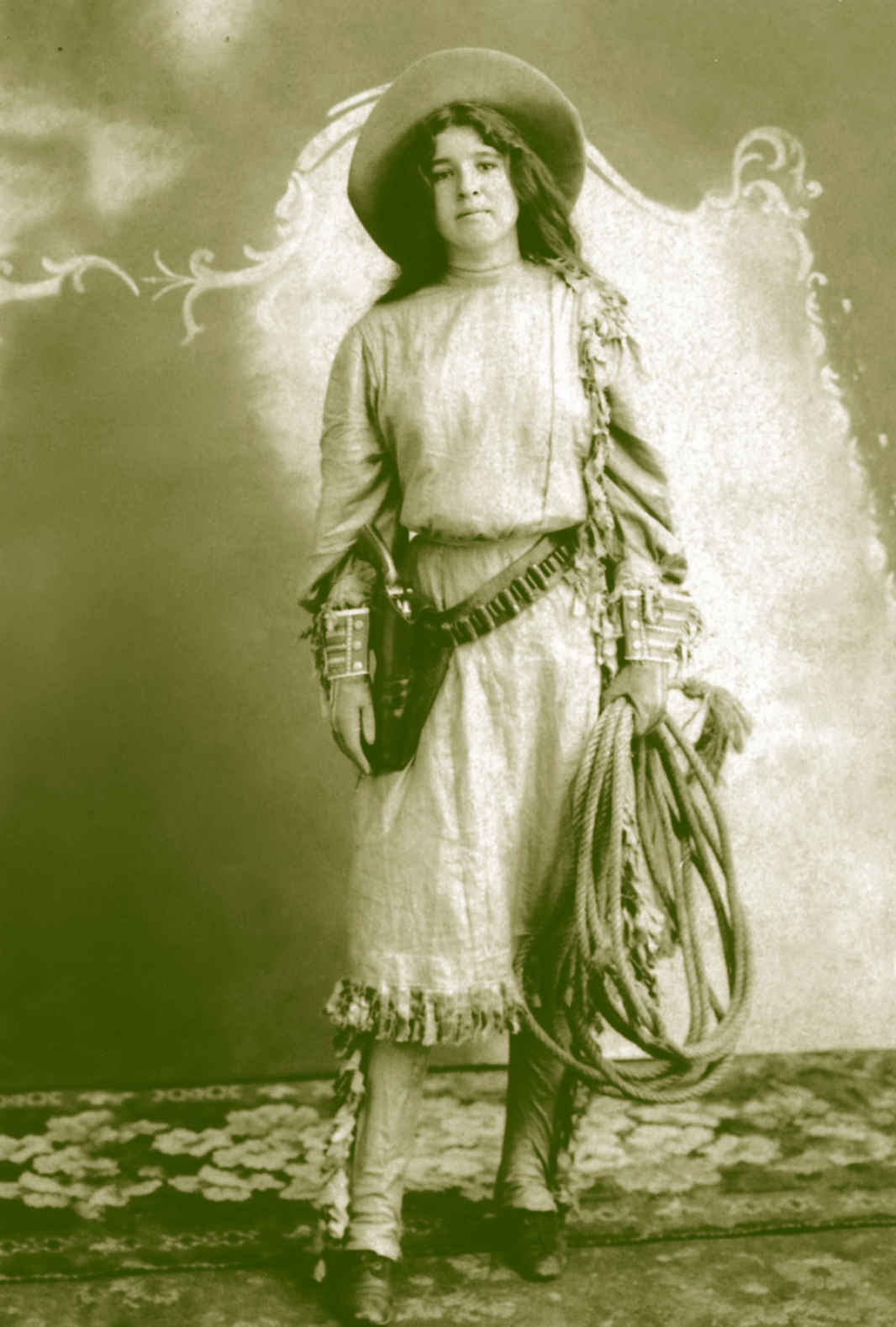 Photo of cowgirl holding rope.