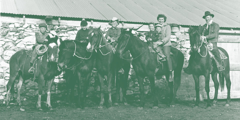 Photo of family on horses.