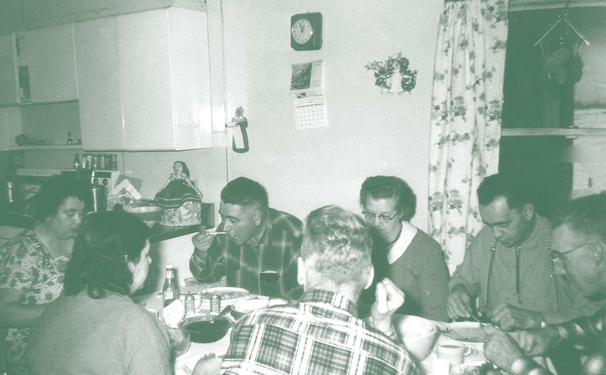 Photo of family eating together.