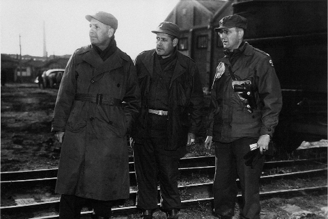 US Officers Watching Destruction Harbor at Hungnam.tif