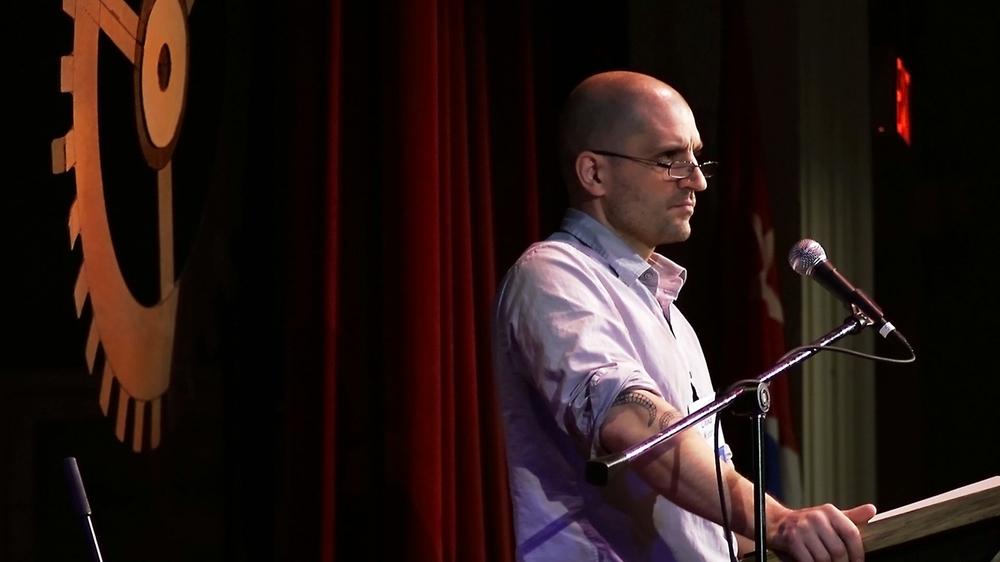 Man in front of the gear—China Miéville on stage at the Key West Literary Seminar (photo courtesy of Byrd McDonald)