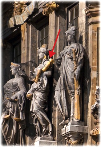 The Sharpen tool isn’t meant for sharpening whole photos, but it’s great for sharpening details.Here it’s being used to touch up the details in the middle statue. (The red arrow points to the circular cursor.)Approach this tool with caution: It’s super easy to overdo it. One pass too many or too high a setting and you’ll start seeing artifacts.