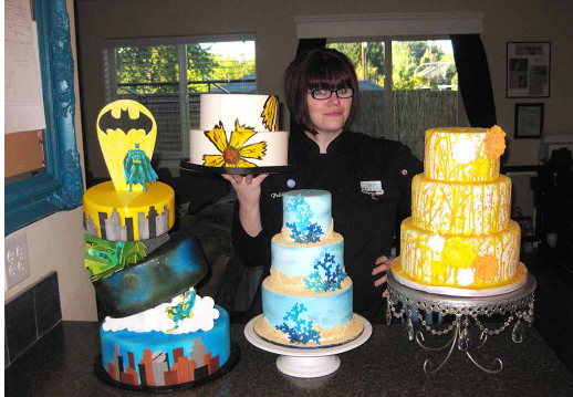 Felicia Hill with a selection of her decorated cakes. COURTESY OF FH CAKES