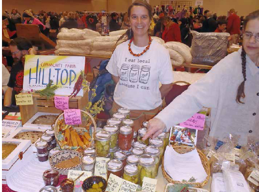 Erin Schneider selling at the Fair Trade Holiday Festival in Madison, Wisconsin. COURTESY OF HILLTOP COMMUNITY FARM