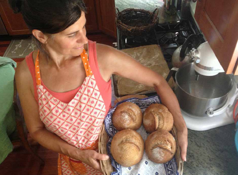 Seedsower Farm owner Regina Dlugokencky holding her fresh-baked bread. COURTESY OF SEEDSOWER FARM