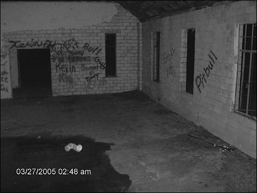 A strange pink light (above time stamp) was captured on film during an investigation at the church.