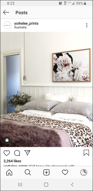 Screenshot of the photo from @yorkelee_prints putting the product, their framed print, in an actual living space, surrounded by furniture and décor, making it more appealing than just hanging on a blank wall.