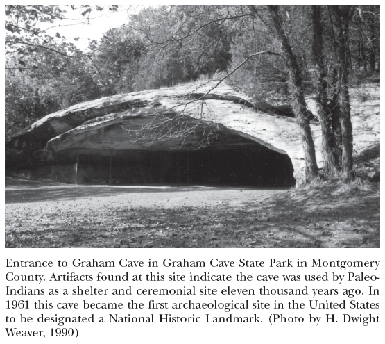 Image: Entrance to Graham Cave in Graham Cave State Park in Montgomery County. Artifacts found at this site indicate the cave was used by Paleo-Indians as a shelter and ceremonial site eleven thousand years ago. In 1961 this cave became the first archaeological site in the United States to be designated a National Historic Landmark. (Photo by H. Dwight Weaver, 1990)