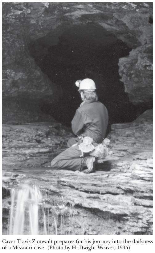 Image: Caver Travis Zumwalt prepares for his journey into the darkness of a Missouri cave. (Photo by H. Dwight Weaver, 1995)