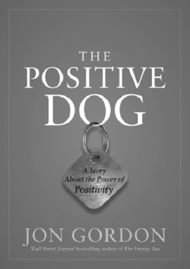 A cover page from Jon Gordon's “The Positive Dog” depicts a metallic diamond shape key chain with a tag line “A story about the power of positivity.”