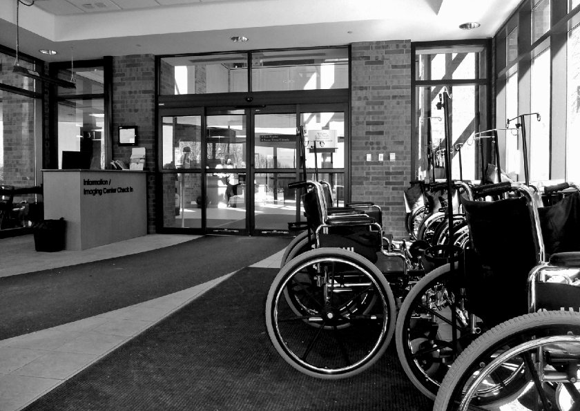 The photograph depicting wheelchairs in the storage areas at health facility entrance.