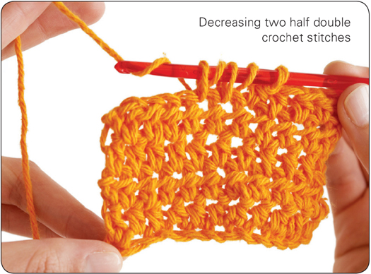 Decreasing two half double crochet stitches