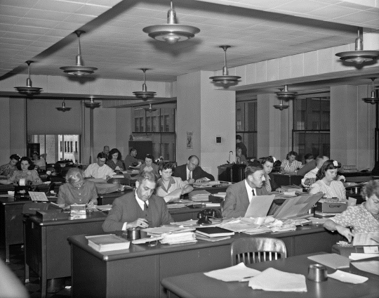 Photograph depicting the experts doing the knowledge work at Ford motor company.