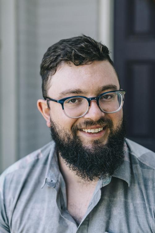 A person wearing glasses

Description automatically generated
