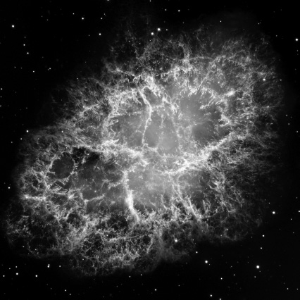 Start of image description, The Crab Nebula is a supernova remnant and pulsar wind nebula in the constellation of Taurus. In visible light, the Crab Nebula consists of an oval-shaped mass of filaments surrounding a diffuse blue central region. This mosaic image was captured by the Hubble Space Telescope over a 2 year period from 1999 to 2000., end of image description