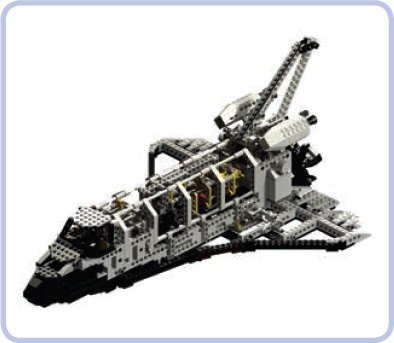 The 8480 Space Shuttle set does an excellent job modeling the complex shape of the real vessel with bricks and hinge plates. Studless pieces are present, but they don’t dominate yet.