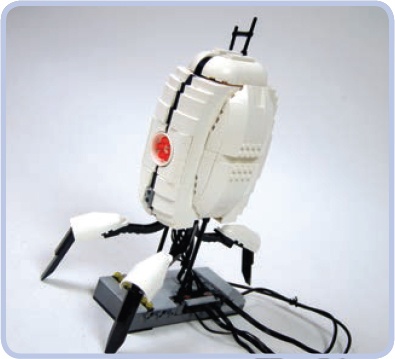 My model of a sentry turret from the Portal game used a complex combination of pieces to create an egg-shaped body. The body consisted of five separate studfull parts—front, rear, left, right, and top—attached around a studless skeleton. No existing studless pieces could achieve that body shape.