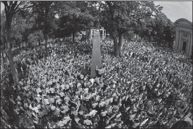 The Class of 2002 worked as a team to climb the 21-foot gray monument in two hours and twenty-six minutes. (Courtesy U.S. Naval Academy)