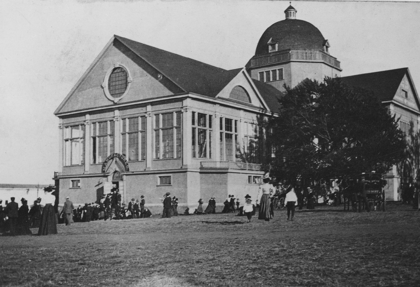 Photograph of the Main Exhibition Building, Halifax, before the explosion. It has a cross-hipped roof with a doom constructed at the intersection of the two blocks.