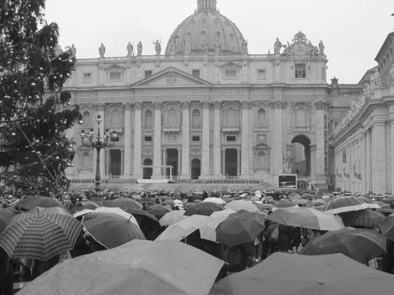 St. Peter's Square with a crowd under umbrellas