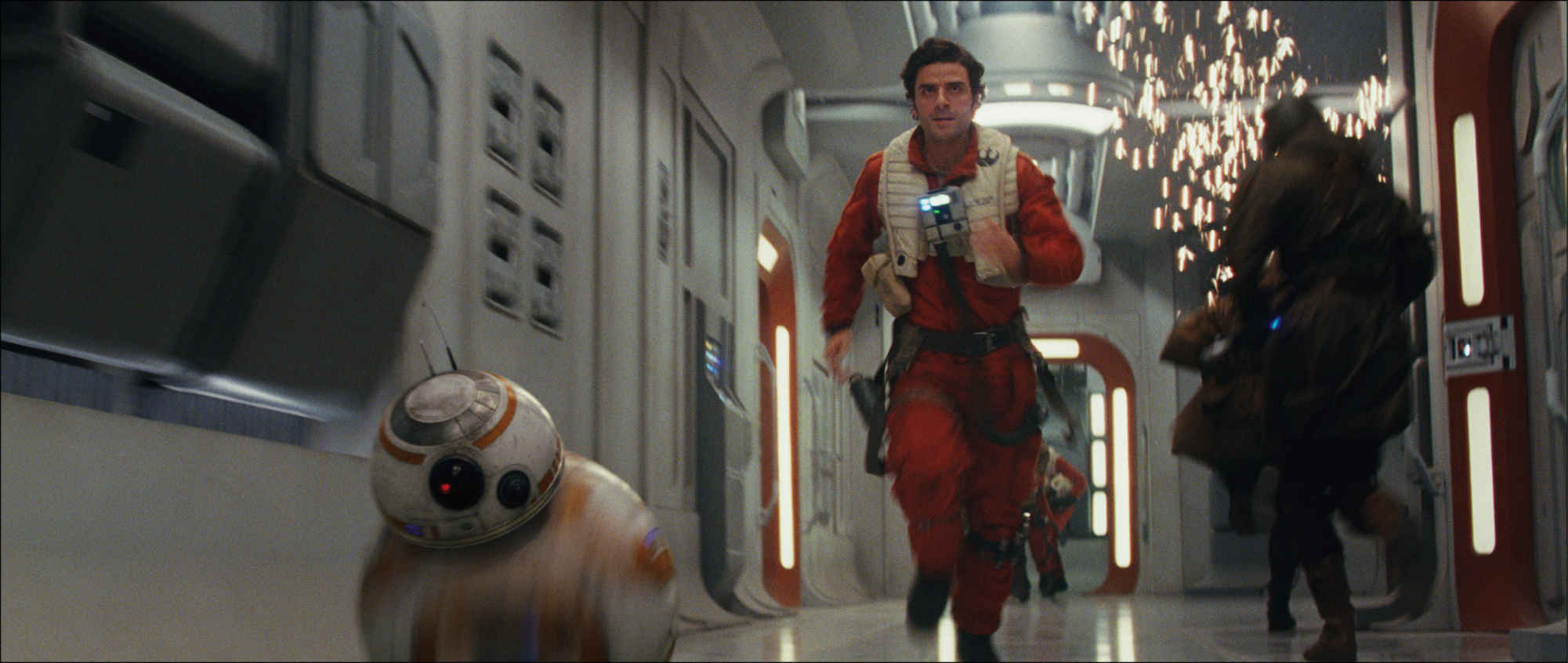 Star Wars: The Last Jedi  L to R: BB-8 and Poe Dameron (Oscar Isaac)  Photo: Film Frames Industrial Light & Magic/Lucasfilm  ©2017 Lucasfilm Ltd. All Rights Reserved. 
