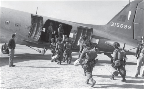 Gurkhas board a 317th Troop Carrier Squadron C-47 for transport to Thabutkon. (U.S. Army Air Forces archives)