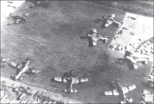 2nd ACG P-51s, carrying their distinctive lightning bolt insignia, on a pierced steel planking hardstand at Cox’s Bazar. (Courtesy of the World War II Air Commando Association via Edward Young)