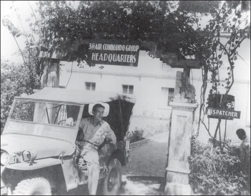 The 3rd ACG’s commander, Col. Arvid Olson, at his headquarters, which had been established in a school in San Nicolas, Luzon. Note the dispatcher working in the open. (U.S. Army Air Forces archives)