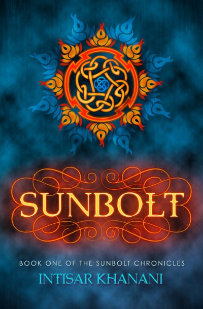 The cover for “Sunbolt,” featuring a flower / sun like symbol composed as follows: the center is a small blue knot surrounded by a second interwoven / never ending knot of yellows and oranges. A red circle with jagged inserts surrounds this, and the petals are composed of flame-like lotus flowers first in oranges and reds and the, further back, in blues. The overall background is a smoky blue. Beneath the emblem, the word SUNBOLT is written with a glowing yellow-orange lettering, over a glowing flourish. At the bottom are the words, “Book One of the Sunbolt Chronicles” followed by the author’s name, “Intisar Khanani.”