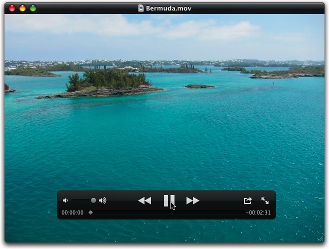 Once you’re in QuickTime Player, you can control the playback of the slideshow in a number of ways. If you don’t feel like clicking and dragging onscreen controls, the arrow keys adjust the volume (up and down) or step through the photos one at a time (right and left).