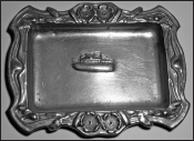 This brass tray, 5 by 3.85 inches, is not shown in the John Bull Victory Souvenirs catalog, but it is a genuine artifact. Claas Stöckmeyer collection