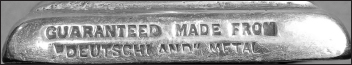 This stamped warranty is found on cast-brass souvenirs and ashtrays. Photo by the author taken from his own collection