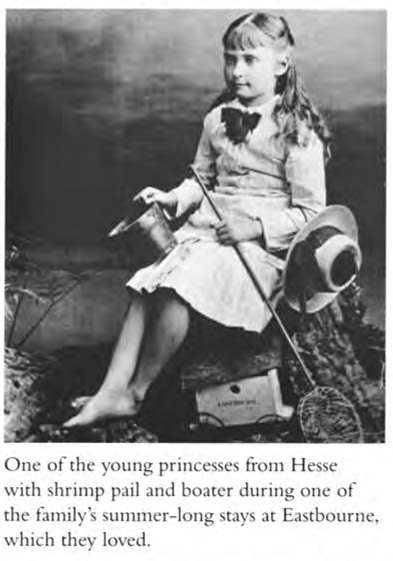 One of the young princess from Hesse with shrimp pail and boater during one of the family’s summer-long stays at Eastbourne, which they loved.