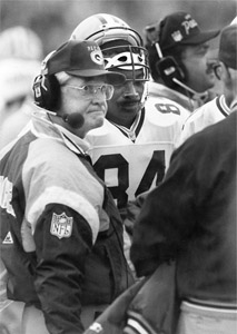 Lindy Infante (left, standing next to Sterling Sharpe) was fired following the 1991 season after compiling a 24–40 record in four seasons in Green Bay. (from the green bay press-gazette archives, reprinted by permission)