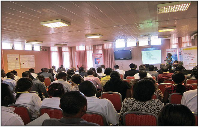 Photo of an on-going conference taken from the back of the hall.