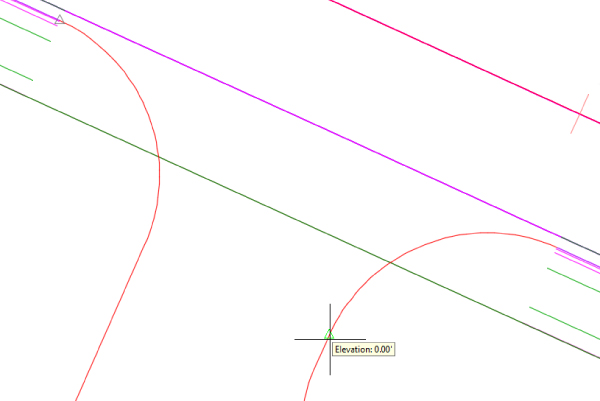 Similar to Figure 14.23, except the equilateral triangular glyph is positioned before the curve, and the cursor is now on the opposite side of the curb indicating elevation.