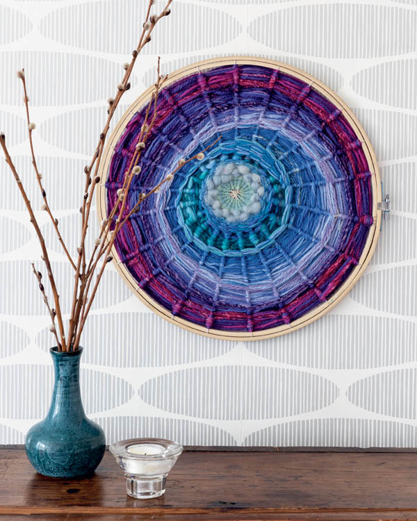 An embroidery hoop hanging on a wall